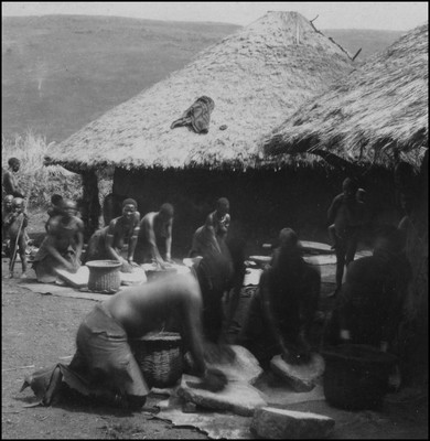 Kisii women grinding grain