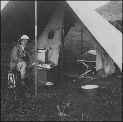 Eric Beavon sitting inside a tent shelter