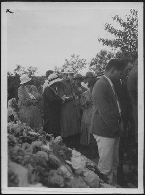 Leatha Coulston surrounded by other missionary wives at her husband's funeral