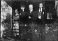 E. A. Sutherland and family on front porch