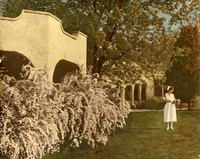 Florence E. Wheeler standing in front of the Madison Rural Sanitarium and Hospital