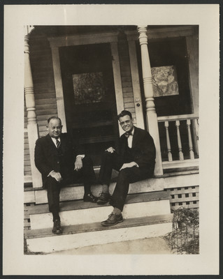 Carlyle and Donald Haynes sitting on a front porch