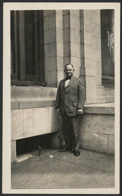 Carlyle Haynes posing in front of a building