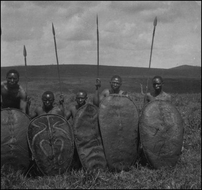 Five Kisii tribesmen with shields and spears