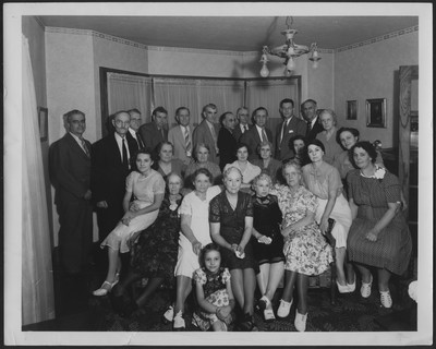 Group of people posing in a living room
