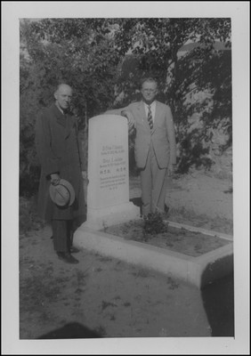 William Harris and unknown man posing by Elmer Coulston's grave