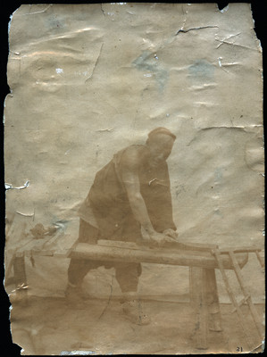 Chinese laborer sanding wood