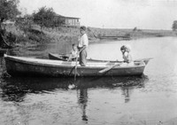 Mary Kate Gafford boating on a lake, possibly with her siblings