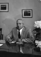 Arthur A. Jasperson sitting at his desk