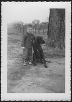 Joseph Duke Sutherland with a black dog