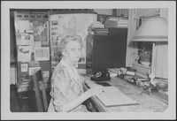 Bessie DeGraw working in an office of Madison College